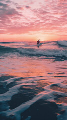 Surfer riding an ocean wave in the sunset 