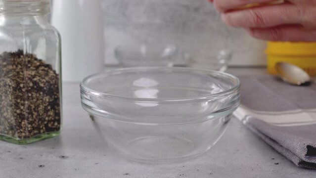 Squizing fresh lemon. Lemon-olive oil salad dressing recipe, ingredients close-up