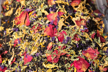 Black tea with flower petals in the oriental bazaar