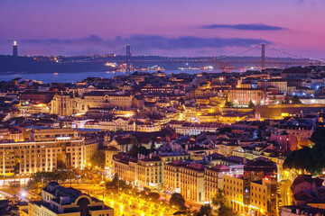 Night view of Lisbon famous view from Miradouro da Senhora do Monte tourist viewpoint of Alfama and...