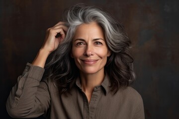 Close-up portrait photography of a satisfied mature woman scratching one's head in a gesture of confusion against a rustic brown background. With generative AI technology