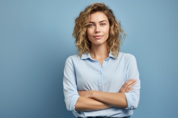Fototapeta premium Close-up portrait photography of a glad girl in her 30s putting hands on hips against a soft blue background. With generative AI technology
