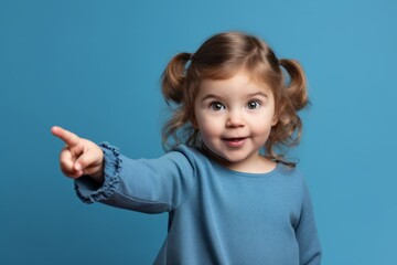 Medium shot portrait photography of a glad girl in her 30s pointing at oneself with the index finger against a baby blue background. With generative AI technology