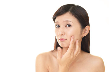 Fototapeta premium スキンケアに不満な女性
