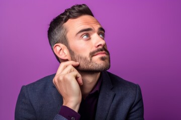Headshot portrait photography of a glad boy in his 30s putting the hand on the chin as if thinking against a lilac purple background. With generative AI technology