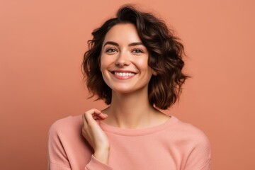Fototapeta premium Headshot portrait photography of a satisfied girl in her 30s pointing down against a coral pink background. With generative AI technology