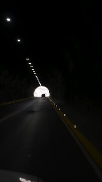 view from the passenger side of the car in a tunnel