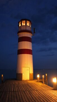 Lighthouse at Lake Neusiedl at Night Vertical Video
