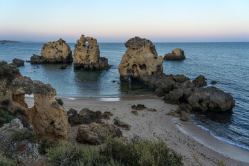 Arrifes beach at sunset in the Algarve region with its famous rock formations, Albufeiroa, Portugal