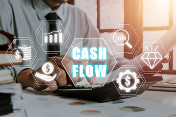 Cash flow concept, Businessman using calculator and analyzing business charts on office desk with cash flow icon on virtual screen.