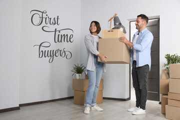 First-time buyer. Happy couple with moving boxes entering their new apartment
