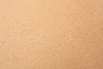 Texture of beige paper sheet as background, closeup