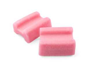 Tasty pink chewing gums on white background