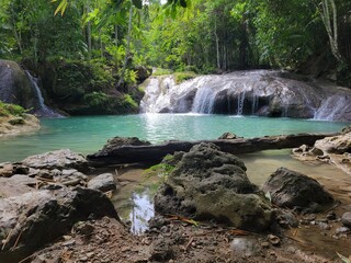Fototapeta na wymiar Waterfall and Turquoise Pool in the Jungle - Siquijor, Philippines