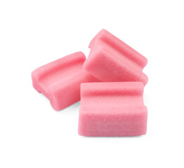 Tasty pink chewing gums on white background