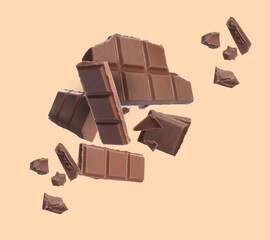 Pieces of chocolate bar falling on beige background