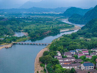 Fototapeta na wymiar Overlook of Chinese rural houses and river scenery
