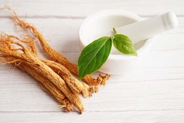 Ginseng roots and green leaf, healthy food.