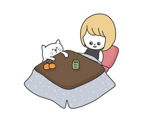 こたつに入る女の子とねこ
