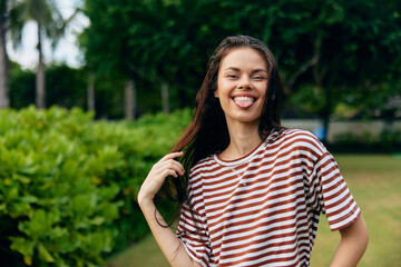 lifestyle woman summer t-shirt smiling sun freedom beautiful nature walk park