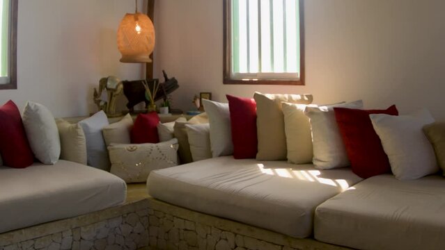 Luxurious warm interior decor,  sofá and handwoven lamp with yute natural rope caribbean lifestyle 