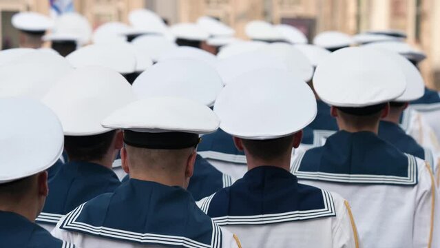 A lot of young sailor march. Naval military forces. 9 may war victory parade. Marine troop army. Navy soldier step close up. Blue suit uniform. Cadets walk slow motion. Kid seal team. Maritime fleet.