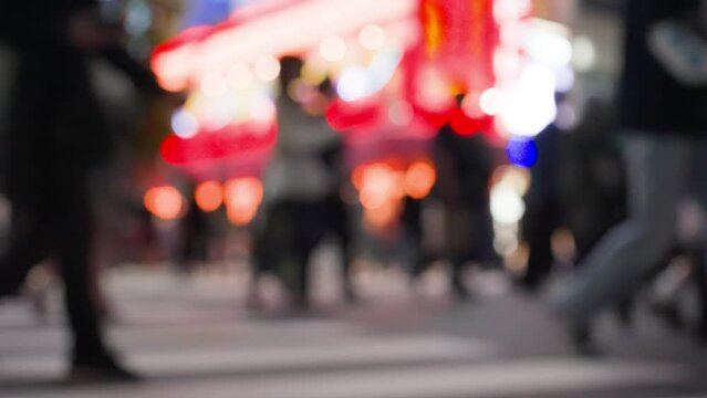 Slow motion crowd of people crossing street at japan. City nightlife tourist and local people