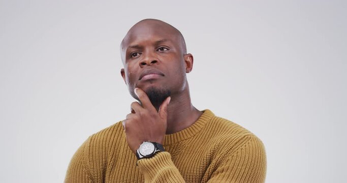 Thinking, wonder and man with question in studio with a contemplating, decision or planning face. Doubt, dreaming and African male person with uncertain or unsure facial expression by gray background