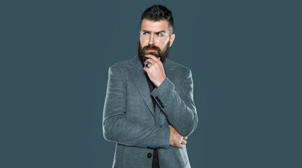 thinking bearded mature man wear casual on grey background
