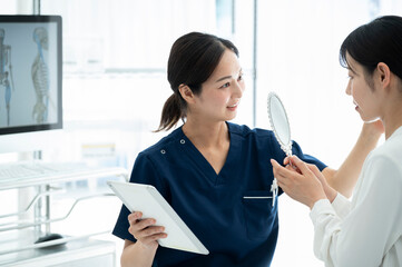 Cosmetic surgeon counseling a patient