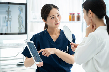 Cosmetic surgeon counseling a patient