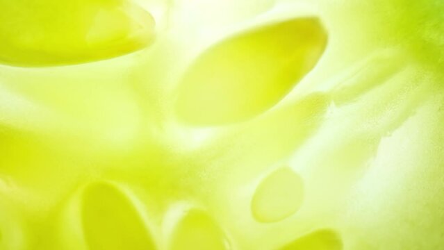 Close-up footage captures the intricate patterns of water droplets on the surface of a cucumber, highlighting its refreshing and hydrating qualities. Fruit and vegetable concept. Cucumber background
