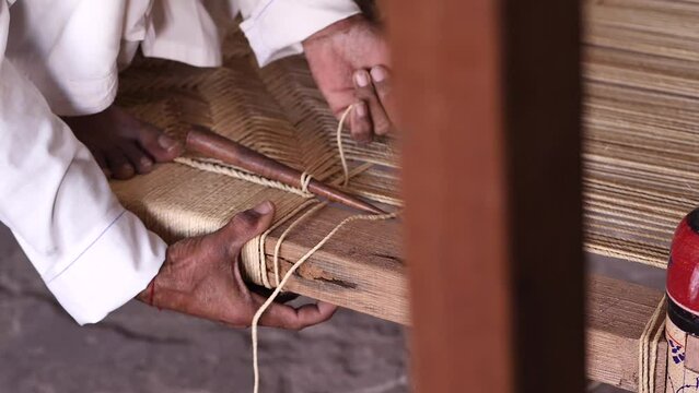 Close Up Of Worker Weaving To Make Charpai, A Traditional Woven Bed In Sindh, Pakistan