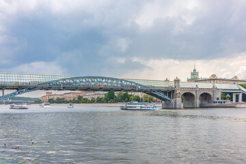 Fototapeta na wymiar View of the Moscow river embakment, Pushkinsky bridge and cruise ships at sunset.
