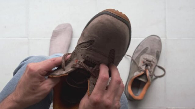 hands of man preparing safety shoe or protection to work
