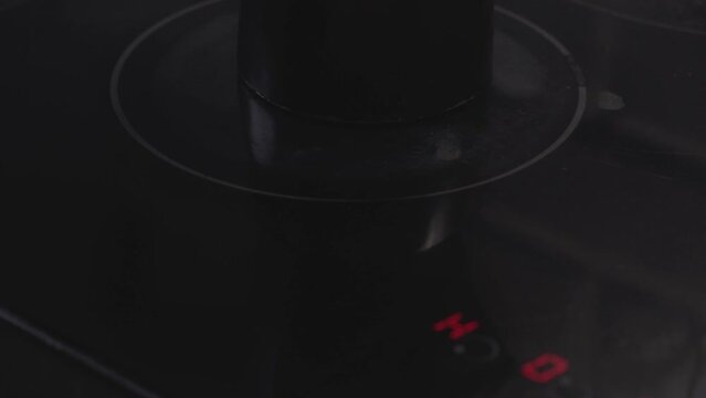 Starting the electric stove to heat or make coffee with a coffee maker
