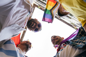 Joyful Circle: Four Gay Friends Embrace Diversity with Pride Accessories