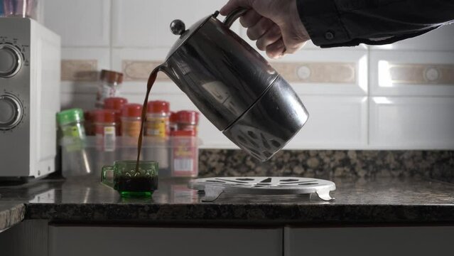 coffee spilling out of a coffee cup
