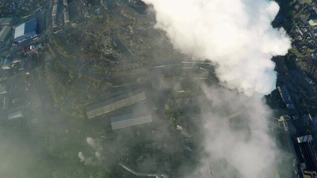 Dense Factory Smoke Clouds, Capturing The Harsh Reality Of Industrial Pollution And Its Environmental Impact.