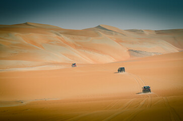 Fototapeta na wymiar Group of safari off road car trip in the desert in Abu Dhabi
