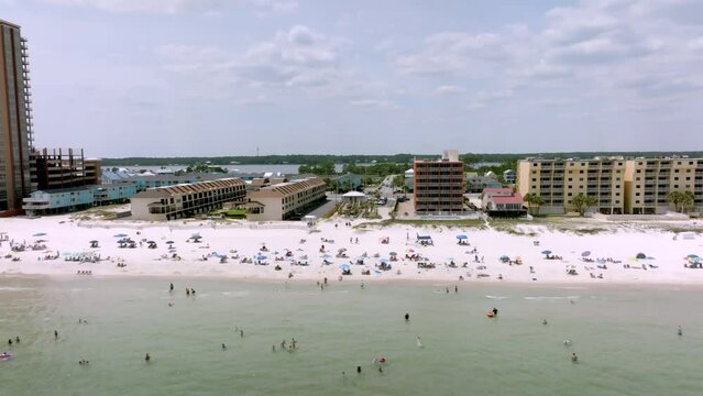 Gulf Shores, Alabama skyline and beach with drone video moving left to right.