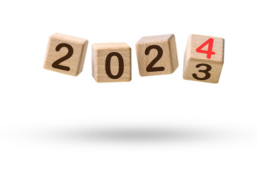 Happy new year concept. Wooden cube blocks changing from New year 2023 to 2024 flying over white