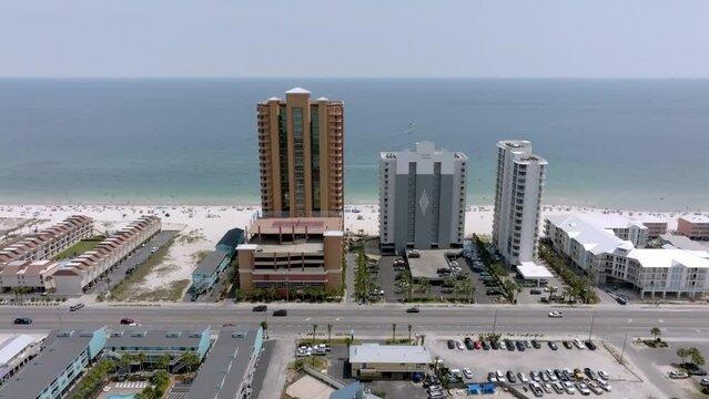 Gulf Shores, Alabama skyline and beach with drone video moving in wide.