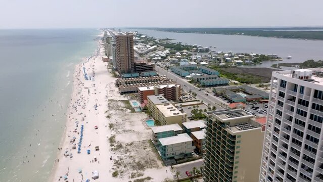 Gulf Shores, Alabama skyline and beach with drone video moving close up.
