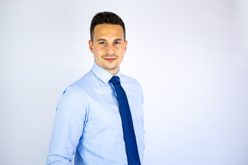 Young smiling business man formal dressed posing isolated on white background. Handsome economist, lawyer, executive director and businessman with hands crossed looking at camera. Copy space.