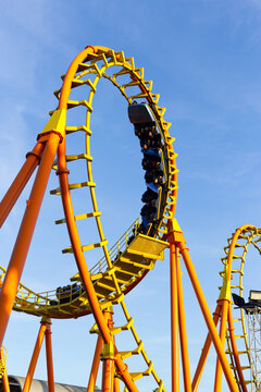 roller coaster ride on a sunny day blue sky