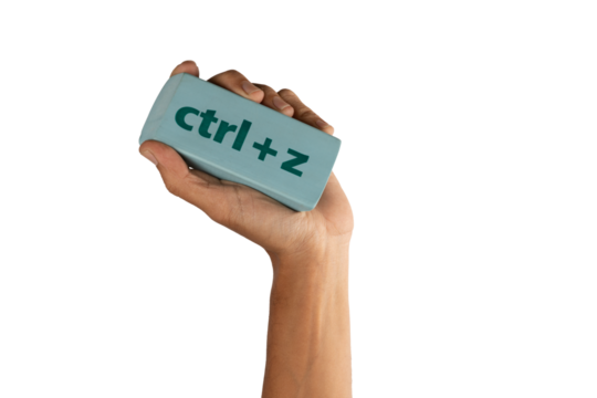 black male Hand holding an eraser with inscription ctrl z on white background