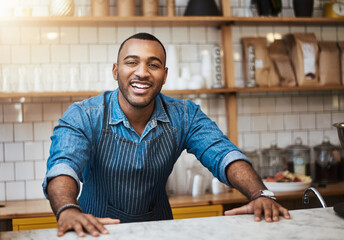 Coffee shop, barista and happy portrait of black man in restaurant for service, working and welcome in cafe. Small business owner, bistro startup and male entrepreneur smile by counter ready to serve