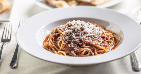 Spagheti pomodoro e basilico with freshly grated parmesan cheese on top