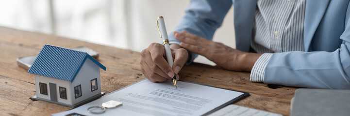 Real estate agent, American businesswoman Africans scrutinize contracts to offer mortgages to...